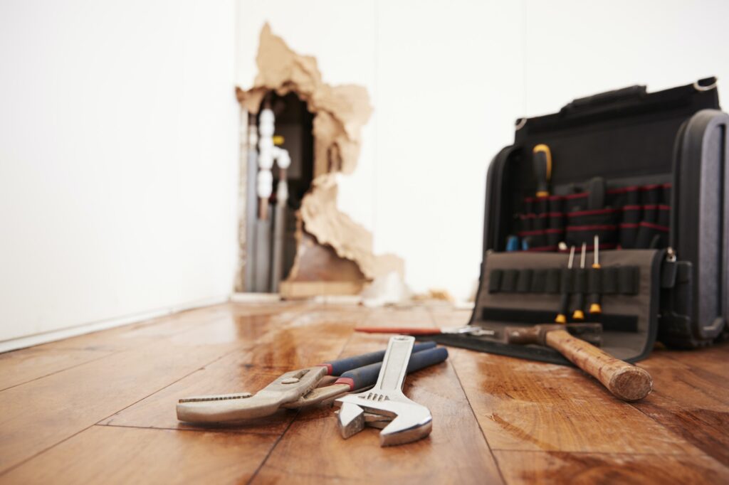Tools and toolbox lying on flood damaged floor
